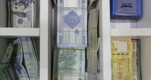 Lebanese pounds and dollars are seen at an exchange shop in Beirut, April 24, 2020. (The Daily Star/Mohamad Azakir)