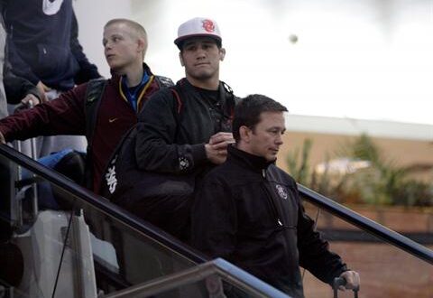 U.S. National freestyle wrestling coach Zeke Jones, right, and his team members arrive at the Imam Khomeini airport in Tehran, Iran, early Tuesday morning, Feb. 19, 2013, to attend World Cup tournament. (AP Photo/Vahid Salemi)
