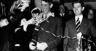 FILE - In this Aug. 8, 1953 file photo, Sir Edmund Hillary, left, and his fellow New Zealander George Lowe, are welcomed home to New Zealand following their arrival by air at Auckland. (AP Photo, File)