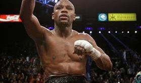 Floyd Mayweather Jr. reacts to fans as he sits atop the shoulders of Leonard Ellerbe after defeating Robert Guerrero during a WBC welterweight title fight, Saturday, May 4, 2013, in Las Vegas. (AP Photo/Isaac Brekken)