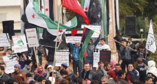 Anti-Syrian regime protesters hold up banners during a demonstration, in Idlib, Syria, Friday, March 2, 2012. (AP Photo/Local Coordination Committees in Syria