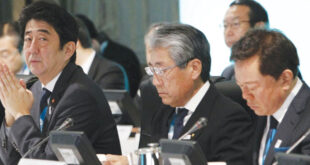 Japanese Prime Minister Shinzo Abe, second right, accompanied by Japan Olympic Committee President Tsunekazu Takeda, right, attends a presentation by Tokyo 2020 Bid Committee for the panel of the International Olympic Committee's evaluation commission in Tokyo Monday, March 4, 2013. (AP Photo/Tokyo 2020 Bid Committee)