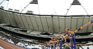 Athletes clear the first hurdle in the women's 100m hurdles during the BUCS Outdoor Athletics Championships at the Olympic Stadium in London May 6, 2012. REUTERS/Dylan Martinez