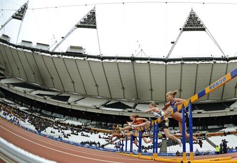 Athletes clear the first hurdle in the women's 100m hurdles during the BUCS Outdoor Athletics Championships at the Olympic Stadium in London May 6, 2012. REUTERS/Dylan Martinez