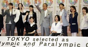 Tokyo Gov. Shintaro Ishihara, center, chairman of Tokyo 2020 Council, shows his spirit with Japanese Olympians and Paralympians during a press conference in Tokyo Thursday, May 24, 2012. (AP Photo/Koji Sasahara)