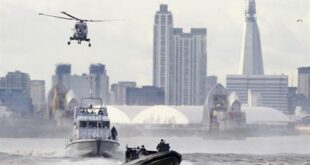 In this Thursday, Jan. 19, 2012 file photo security forces take part during in a combined British police and British Royal Marines security exercise for the London 2012 Olympic Games. (AP Photo/Alastair Grant)