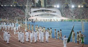 In this Saturday, July 25, 2012 file photo, members of Saudi Arabia's team walks in Olympic Stadium in Barcelona during the opening ceremonies of the XXV Olympics. (AP file photo/Cliff Schiappa)
