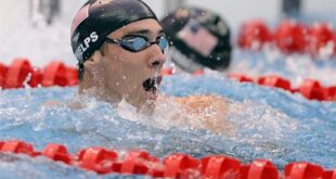 This file photo shows United States' Michael Phelps reacting after winning the gold medal in the men's 100-meter butterfly final during the swimming competitions in the National Aquatics Center at the Beijing 2008 Olympics in Beijing. (AP Photo/Mark J. Terrill, File)