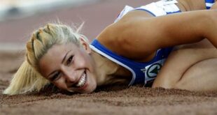 Greece's Voula Papachristou lands in the sand after her jump at the Women's Triple Jump final at the European Athletics Championships in Helsinki, Finland, in this file photo dated Friday, June 29, 2012. (AP Photo/Matt Dunham, file)
