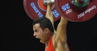 Tunisian's Khalil El Maoui competes in the weightlifting men's 56kg group A at The Excel Centre in London on July 29, 2012, during the London 2012 Olympic Games. (AFP PHOTO / YURI CORTEZ)