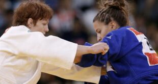 Elisabeth Willeboordse of Netherlands competes with Caren Chammas of Lebanon, right, during the women's 63-kg judo competition at the 2012 Summer Olympics, Tuesday, July 31, 2012, in London. (AP Photo/Paul Sancya)