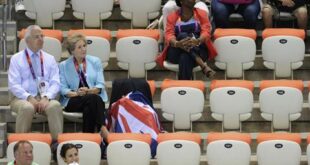 Former British Prime Minister John Major (L) and his wife Norma (2nd L) watch the men's synchronised 10m platform final during the London 2012 Olympic Games at the Aquatics Centre July 30, 2012. London Olympic organisers were under intense pressure to fill stadiums and venues on Monday on the third day that empty seats clearly visible on television infuriated British viewers who would much rather have experienced the Games live. REUTERS/Paul Hackett