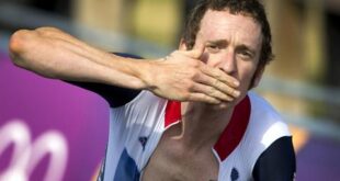 Wiggins approaches the finish line to win the gold.