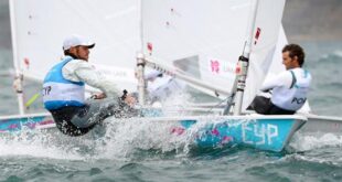 Cyprus' Pavlos Kontides, left, rounds the mark in the Laser sailing class in Weymouth on August 1, 2012 during the London 2012 Olympic Games. AFP PHOTO/William WEST