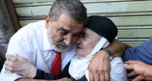 One of the Lebanese Shiite pilgrims that Syrian rebels have been holding hostage in Syria, hugs his mother, right, upon arrival at his house in the southern suburb of Beirut, Lebanon. (The Daily Star/Hasan Shaaban)