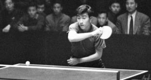 In this photo taken on April 9, 1961 and released by China's Xinhua News Agency, Zhuang Zedong, right, competes in the men's team finals of the 26th World Table Tennis Championship in Beijing. (AP Photo/Xinhua, Zhang Hesong)