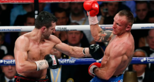 Carl Froch of Britain, left, fights against Mikkel Kessler of Denmark during their super-middleweight world title unification boxing match at O2 Arena in London, Sunday, May 26, 2013. (AP Photo/Sang Tan)