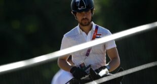 Small protest greets Syrian Olympian