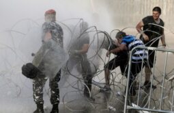 Riot police charge 'YouReek' protest, 1 hurt